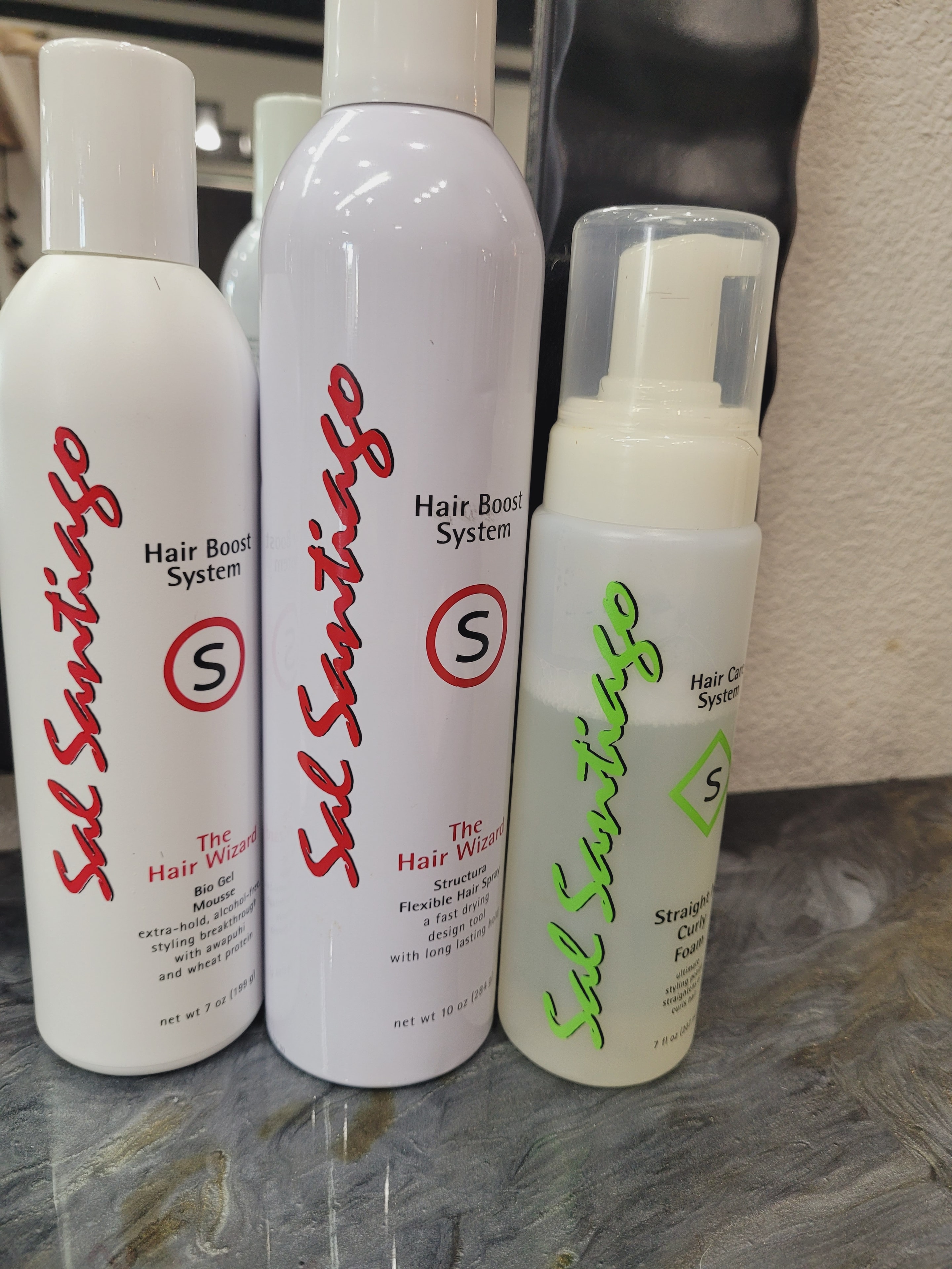 Sal Santiago hair boost system product bottles